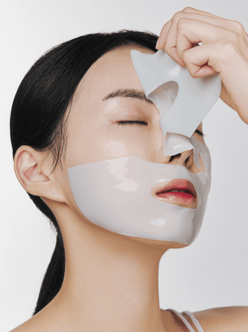 Applying Nacific Green Tea Cica Collagen Gel Mask to hydrate, soothe, and boost skin elasticity.