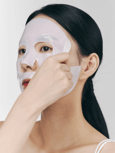 Applying Nacific Rice Pepta Collagen Gel Mask to deeply hydrate and reduce fine lines for a glowing complexion